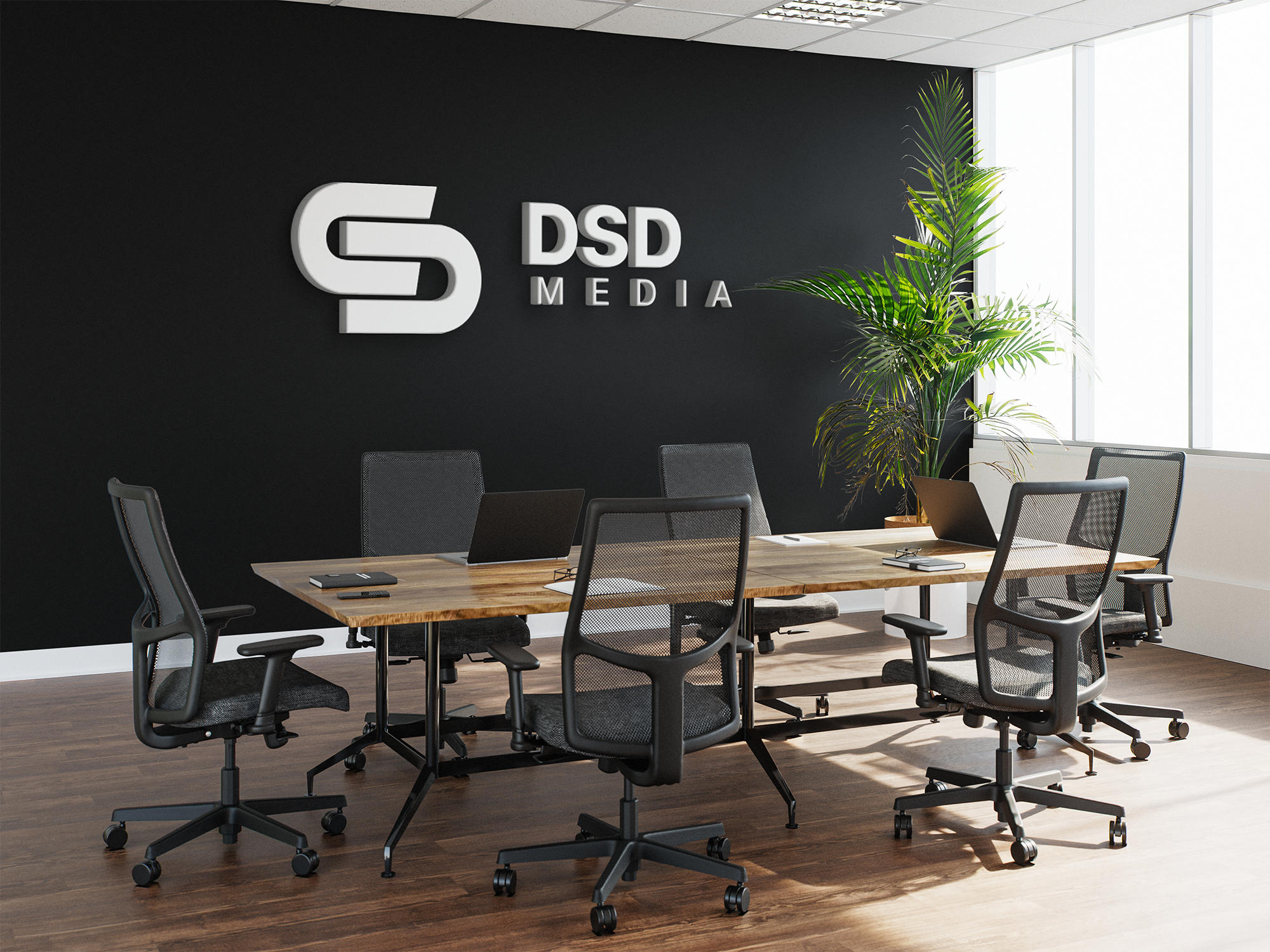 Modern office workspace showing monitors and team collaboration